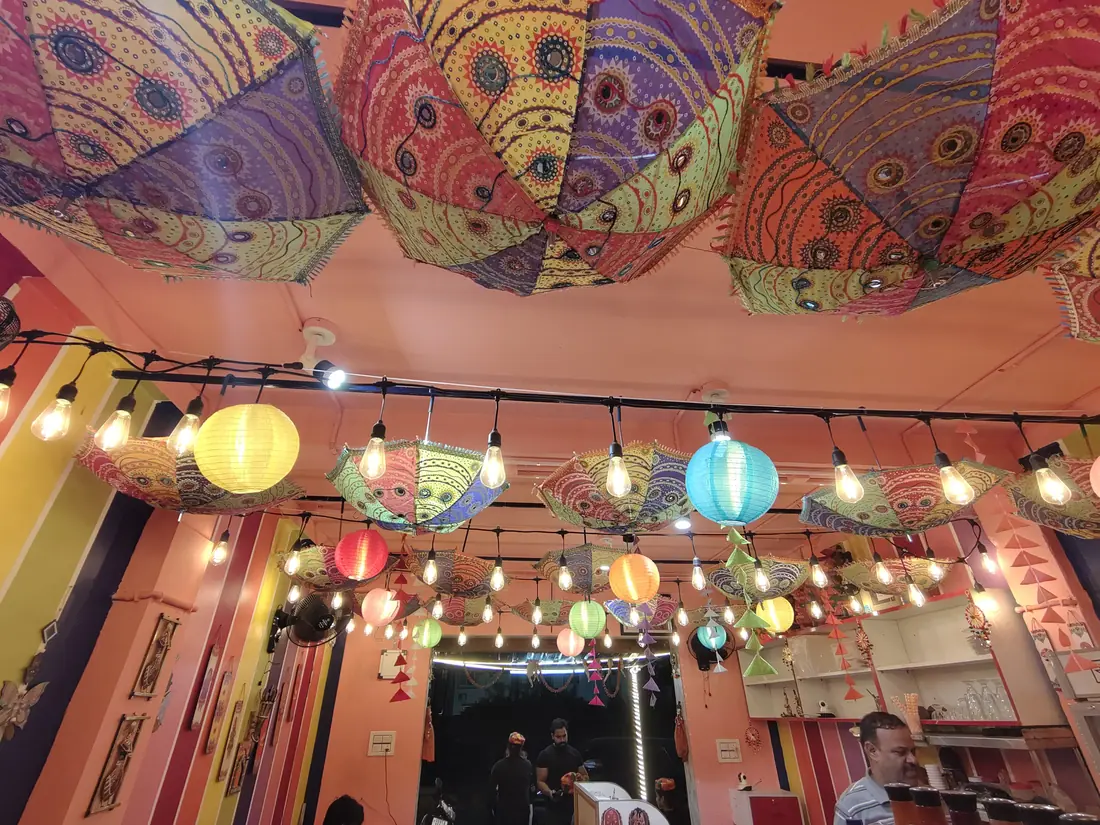 Hanging Rajasthani umbrellas and paper lanterns on the ceiling